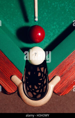 Billiard balls near pocket Stock Photo