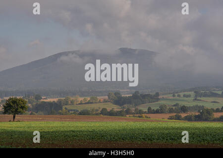 Rising mist over the undulated fields in October morning Stock Photo