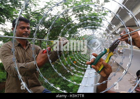 Secured with razor wire on top of the iron fence . Stock Photo