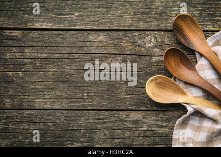 Handmade wooden spoons on old wooden table. Top view. Stock Photo