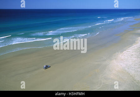 Seventy-five Mile Beach with 4WD vehicle, Stock Photo
