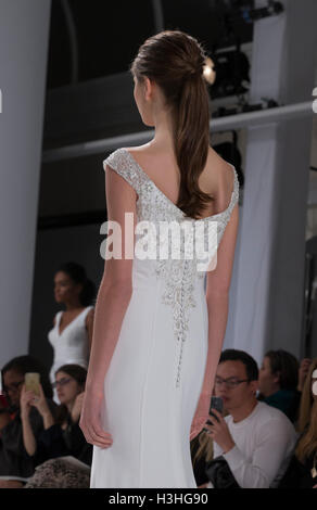 New York, NY USA - October 5, 2016: Model walks runway for collection by Dennis Basso during New York Bridal week at Kleinfeld Stock Photo