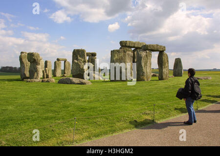 A visitor stands in awed silence in front of the 4600 year old stones of the neolithic monument Stonehenge in on Salisbury Plain in Wiltshire, England.