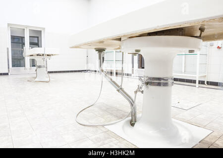 Autopsy antique tables in the morgue in clinic Stock Photo