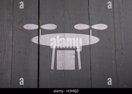 White drone on black wooden background Stock Photo