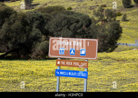 Tourist brown sign for Stokes Bay on the north coast of Kangaroo island,South Australia during spring time. Stock Photo