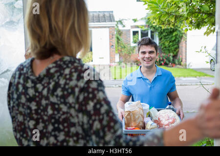 Driver Delivering Online Grocery Order Stock Photo