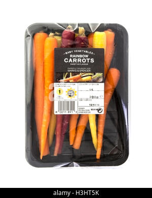 Packet of fresh Rainbow Carrots isolated on white Stock Photo