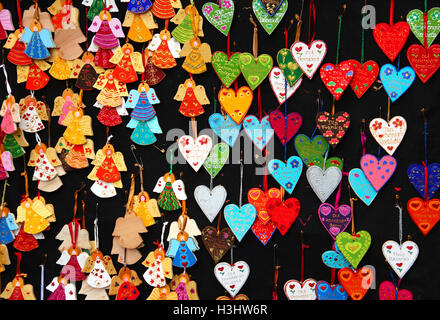 Painted souvenir hearts and angels at the Christmas market in Krakow, Poland Stock Photo