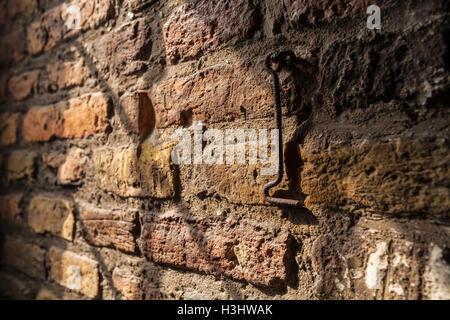 Ancient brick wall and the iron hook inside the new Church in Delft, Netherlands Stock Photo