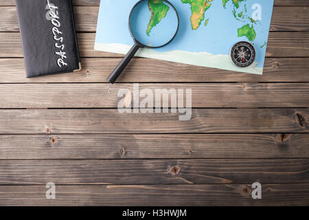 Preparation for Traveling concept, passport, map on a wooden background. with copy space. Stock Photo