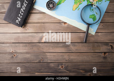 Preparation for Traveling concept, passport, map on a wooden background. with copy space. Stock Photo