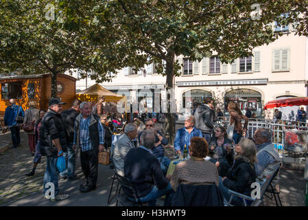 People sitting in a street cafe, Place du Marche in Carouge, Geneva, Switzerland Stock Photo