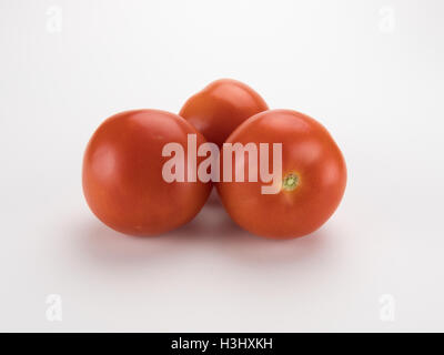 Tomatoes in a bunch isolated on a white background Stock Photo
