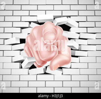 Hand pointing breaking through a white brick wall Stock Photo