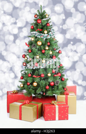 Christmas tree background snow snowing lights advent golden balls decoration Stock Photo