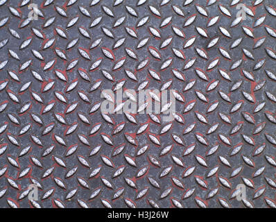 closeup shot of  dirty metallic surface with diamond plate pattern, top view Stock Photo