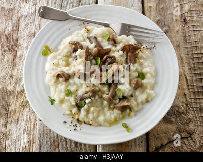 Sauteed wild organic Pied Bleu Mushrooms (Clitocybe nuda), Blewit or Blue Foot mushrooms cooked in butter and herbs Risotto Stock Photo