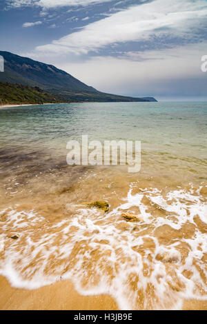 The waves crash on the beautiful sandy beach of Trapezaki, Kefalonia. Stock Photo
