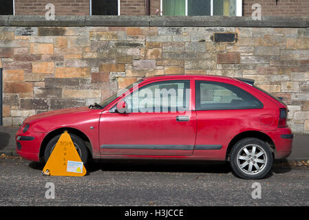 Untaxed car clamped by the DVLA. Stock Photo