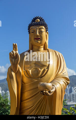 Closeup of a smiling Buddha statue at the Ten Thousand Buddhas Monastery (Man Fat Tsz) in Sha Tin (Shatin), Hong Kong, China. Stock Photo