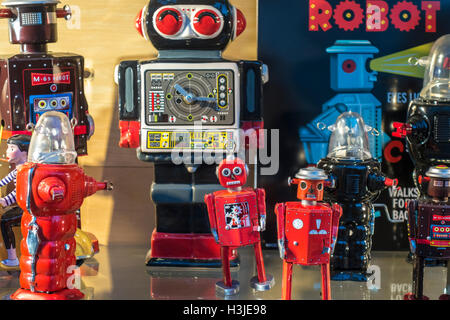 Group of Retro Robot toys. Vintage tin robots on display. Stock Photo