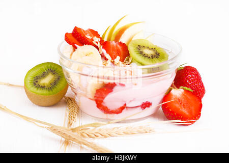 Yogurt with exotic fruits and cereals on a white background Stock Photo