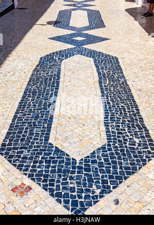 Black and white ornamental paving tiles in Lagos city, Portugal Stock Photo