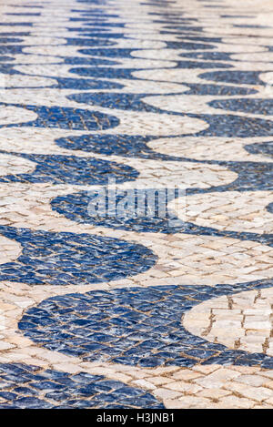 Black and white patterned paving tiles in Lisbon city, Portugal Stock Photo