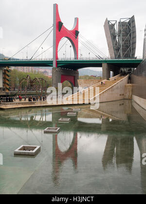 La Salve Bridge reflected in the water mirror of the Guggenheim Museum Bilbao Stock Photo