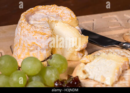 Soft French cheese with grapes Stock Photo