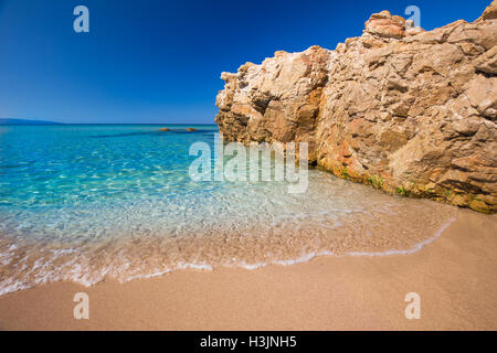 Beautiful sandy beach with rocks and tourquise clear water near Cargese, Corsica, France, Europe. Stock Photo