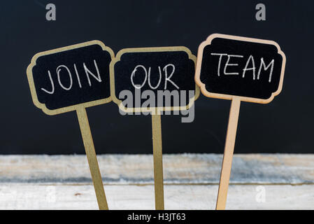 Business message JOIN OUR TEAM written with chalk on wooden mini blackboard labels Stock Photo
