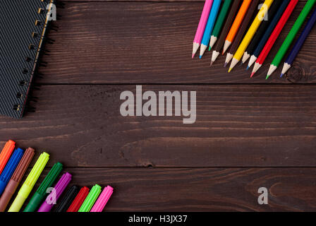 Colored pencils on a wooden board Stock Photo