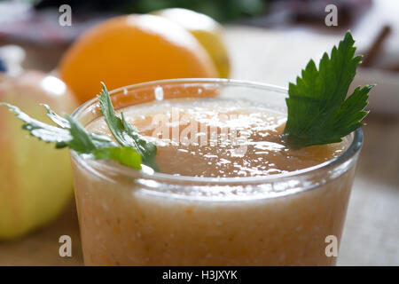 Fresh lemonade with ginger served on a table full with other fruits and cinnamon Stock Photo