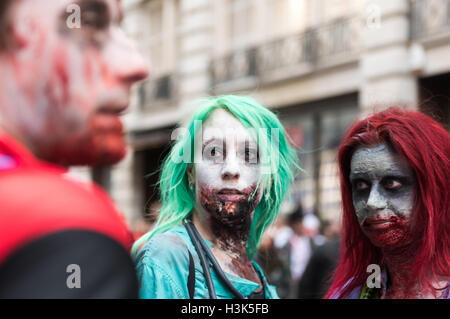 London, UK, 8 October 2016. Zombies in Central London celebrating World Zombie Day while raising funds for St Mungo's supporting the Homeless. Credit: pmgimaging/Alamy Live News Stock Photo