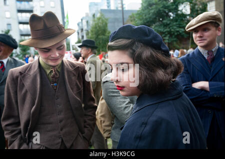 London, UK. 9th October 2016. A few of those taking part in the march and rally in East London celebrating the 'Battle of Cable St' in 1936, came in period dress. On October 4th 1936. the people of the area, mainly Jewish and Irish, ignored the pleading of the Labour Party and others and came in their thousands united as a community to fight the police who were trying to force a route for Oswald Mosley and the British Union of Fascists. Stock Photo