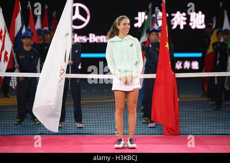 Beijing, China. 9th Oct, 2016. Agnieszka Radwanska (R) of Poland and ...