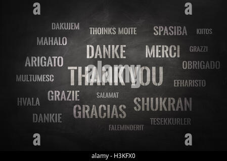 Thank you word cloud written in many different languages on a chalkboard Stock Photo