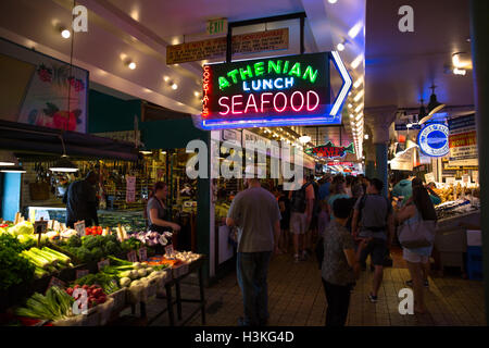 Neon seafood sign inside farmer's market - Seattle, WA Stock Photo