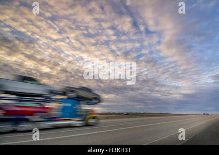 Long haul truck at sunset on Interstate 40 the modern freeway version ...