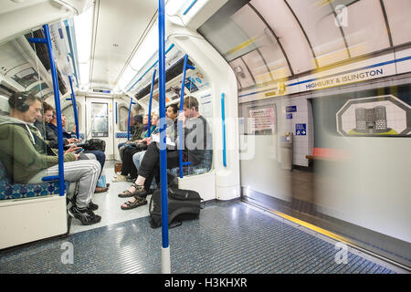 london underground train closing doors at outdoor above ground Stock