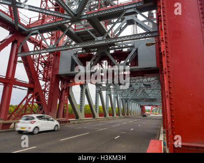 Cars crossing the Newport Bridge over the river Tees Middlesbrough and Stockton Grade 2 listed vertical-lift steel bridge Stock Photo