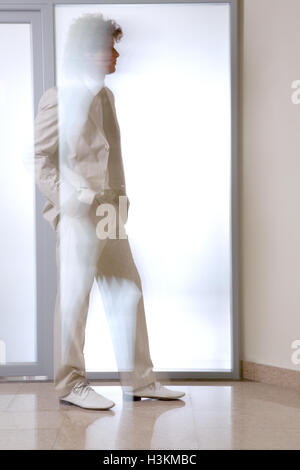 Man walking through walls Stock Photo