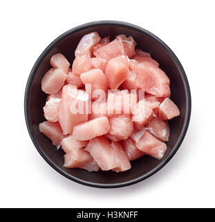 Raw cut meat chunks in white bowl isolated on white background, top view Stock Photo