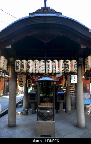 Hozenji tempel or Hozenji shrine on street for japanese people praying at Hozenji Yokocho Alley in Osaka city on July 10, 2015 i Stock Photo