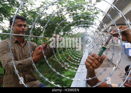 Secured with razor wire on top of the iron fence . Stock Photo