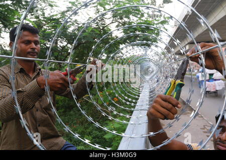 Secured with razor wire on top of the iron fence . Stock Photo