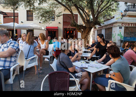 A waitress serves drinks at a Tapas Cafe & Bar in the old quarter of Valencia Stock Photo
