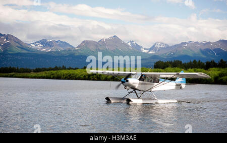 Single Prop Airplane Pontoon PLane Water Landing Alaska Last Frontier Stock Photo